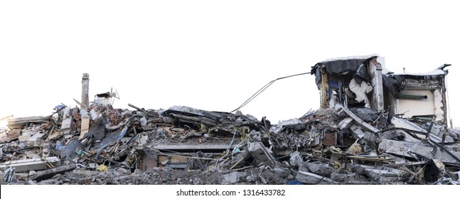Ruined building. A pile of concrete, rubble and reinforcement debris isolated on a white background.