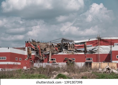 Ruined And Demolished Industrial Building After Fire With Broken Roof, Walls And Piles Of Garbage, Accident Concept.