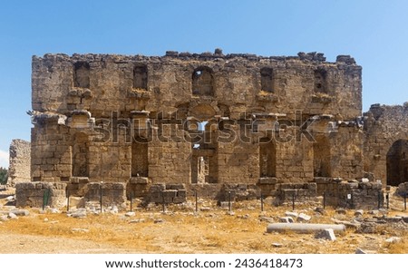 Ruined facade of Nymphaeum in Aspendos, ancient Greco-Roman city in Antalya province of Turkey.