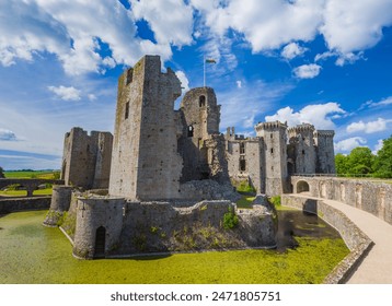 Ruined keep tower at a moat in Raglan Castle (Wales, United Kingdom)