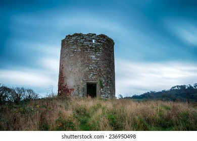 A ruined tower, the remains of Maker windmill near Mount Edgcumbe in Cornwall