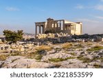 The ruines at Acropilis hill in a summer day, Erechtheum temple as background. Beautiful wallpaper. Art, history or tourism concept. Athens, Greece