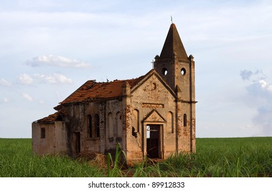 Ruins Of An Abandoned Church In The Field