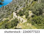 Ruins of Afkule monastery by the Mediterranean coast near Kayakoy village in Mugla province of Turkey. The Greek monastery was abandoned in the 1920s and still towers over the cliffs.