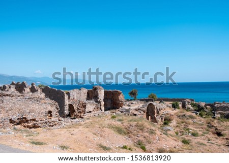 Ruins of Anamurium Ancient City and blue sea in Anamur Town, Turkey