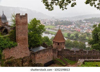 Ruins of ancient castle Wertheim - the most picturesque ruins in Germany  . Top view from  the ruined fortress walls to the old city in the fog. Wertheim am Main. Germany. Tourist  destination
