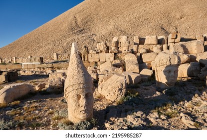 The Ruins Of The Ancient City Nimrod, Nimrod Mountain Local Name Is Nemrut Dagi, During Sunset, Shadow Of Ancient Commegene King.