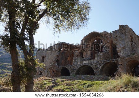 ruins of the ancient coastal city Anamurium, citadel houses, walls broken but still partly standing. Landscape of town Anamur with the beautifully preserved ruins of the ancient city of Anamur, Mersin