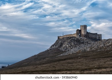 Ruins of ancient Enisala Fortress also referred as Heracleea Fortress on cloudy day in Dobrogea, Romania - Shutterstock ID 593860940