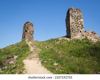 Ruins of ancient gothic castle Brnicko, Czech Republic, Europe. Old ruin with green grass and blue sky in spring sunny day.