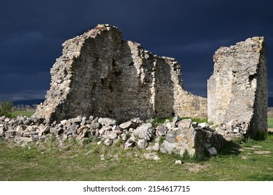 Ruins of an ancient medieval church in Tök, Hungary. There is the stormy sky in the background.