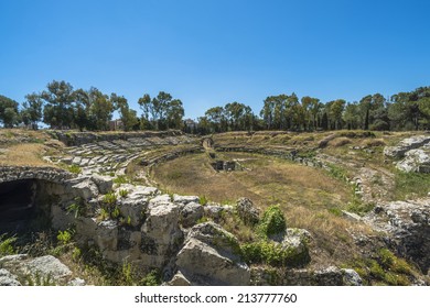 Ruins of ancient Roman amphitheater in Syracuse, Sicily - Shutterstock ID 213777760