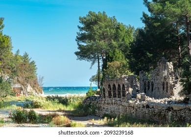 ruins of ancient roman bathhouse at the mouth of the river flowing into the sea in the ancient city of Olympus, Turkey