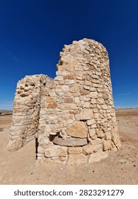 Ruins of ancient stone windmill structure in Campo de Criptana Spain