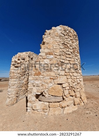 Ruins of ancient stone windmill structure in Campo de Criptana Spain