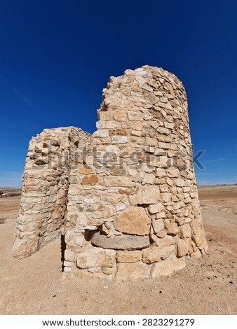 Ruins of ancient stone windmill structure in Campo de Criptana Spain