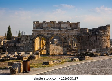 Ruins of Appollo temple with fortress at back in ancient Corinth, Peloponnese, Greece
