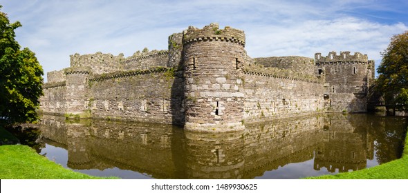 The ruins of Beaumaris Castle built in the 14th century by Edward the first as part of his military fortifications to conquer Wales. It is now a scheduled ancient monument