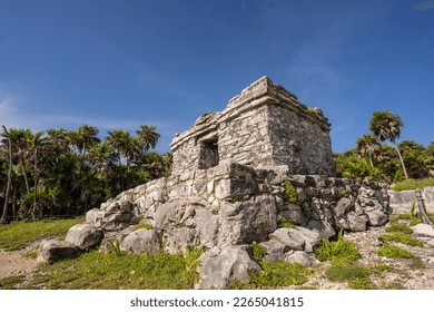 The ruins of a beautiful pyramid in the archaeological zone of Tulum in Mexico. - Shutterstock ID 2265041815