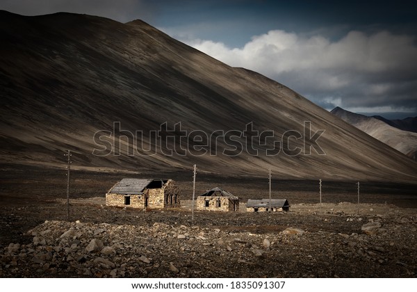 The ruins of the buildings of the Chukotka Forced\
Labor Camp, which was part of the Gulag. The prisoners built the\
Egvekinot-Iultin highway from 1946 to 1951. Chukotka, Siberia, Far\
East of Russia.