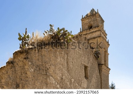 Ruins of a Catholic church built of adobe and wood