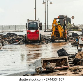 ruins and distructions cousea by a devastating typhoon on a sea coast. wreckage and wastes near sea shore. elimination of the damage and distructions caused by the hurricane to the coast