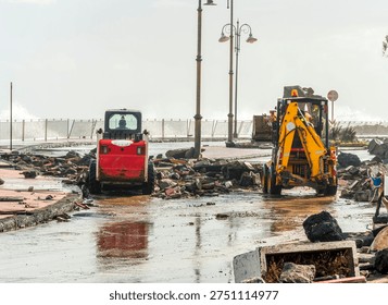 ruins and distructions cousea by a devastating typhoon on a sea coast. wreckage and wastes near sea shore. elimination of the damage and distructions caused by the hurricane to the coast