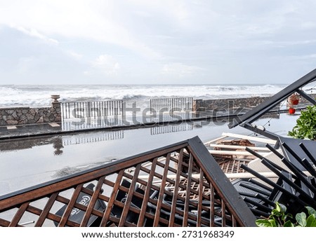ruins and distructions cousea by a devastating typhoon on a sea coast. wreckage and wastes near sea shore. elimination of the damage and distructions caused by the hurricane to the coast