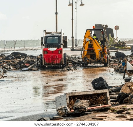 ruins and distructions cousea by a devastating typhoon on a sea coast. wreckage and wastes near sea shore. elimination of the damage and distructions caused by the hurricane to the coast
