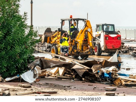 ruins and distructions cousea by a devastating typhoon on a sea coast. wreckage and wastes near sea shore. elimination of the damage and distructions caused by the hurricane to the coast