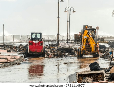 ruins and distructions cousea by a devastating typhoon on a sea coast. wreckage and wastes near sea shore. elimination of the damage and distructions caused by the hurricane to the coast
