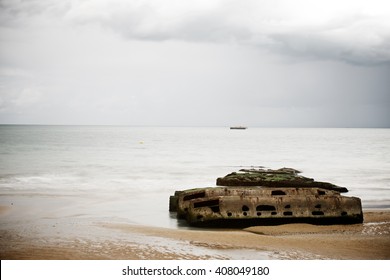Ruins of harbor built by the Allies in Arromanches, Normandy, France.