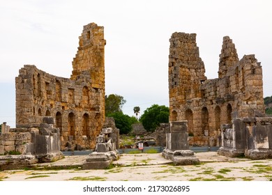 Ruins of Hellenistic gate of Pamphylian ancient city Perge located near modern Antalya, Turkey. View of courtyard and Hadrianus' Arch.