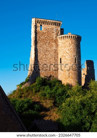 Ruins of Herisson fortress of the Dukes of Bourbon dominate the medieval city of Herisson and Aumance Valley with towers standing tall in inner castle in central France. High quality photo