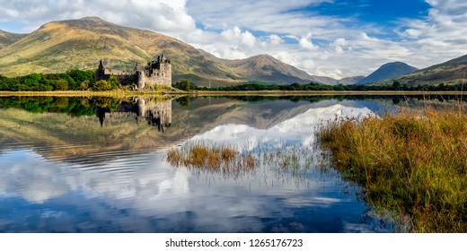 The ruins of Kilchurn castle are on Loch Awe, the longest fresh water loch in Scotland. It can be accessed on foot from Dalmally road on the A85. This image was taken from the opposite bank.  - Shutterstock ID 1265176723