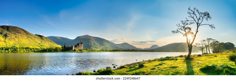 The ruins of Kilchurn castle at sunset on Loch Awe, the longest fresh water loch in Scotland - Powered by Shutterstock