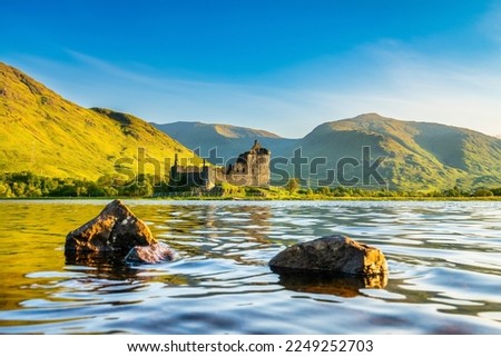 The ruins of Kilchurn castle at sunset on Loch Awe, the longest fresh water loch in Scotland