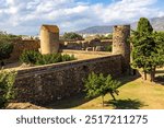 Ruins of the monastery, the town, and the ancient medieval walls of Roses, Spain, inside the citadel