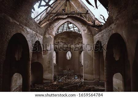 Ruins of the old church near Lviv, Ukraine. Ancient columns, ruined altar, and broken roof. Concept of chaos, evil, and destruction.