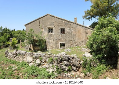 Ruins of an old flourmill in the desert mountain village of The Old Perithia (Ano Palea Perithia), Corfu Island, Greece, Europe
