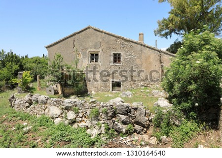 Ruins of an old flourmill in the desert mountain village of The Old Perithia (Ano Palea Perithia), Corfu Island, Greece, Europe
