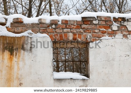 Ruins of an old house in the village in the winter. Poland