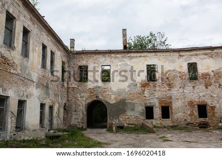 Ruins of old Klevan castle built in 15th century Prince Michael Czartoryski in order to control a ford over the Stubla River. Ruined wall with windows against the blue sky. Rivne region. Ukraine