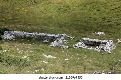 ruins and ruin of an ancient soldiers' barracks used during the First World War in the mountains - Shutterstock ID 2186969353