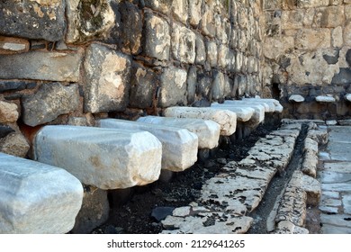 Ruins Of Stone Public Roman Toilets Preserved In Beit Shaan In Israel