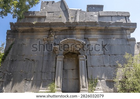 The ruins of Termessos. An ancient megalithic structure in Turkey. Ancient buildings of previous civilizations. Arches made of megalithic stone blocks.