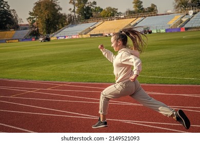 The Rule In Running Is Just Run. Energetic Girl Run On Running Track. Sports School