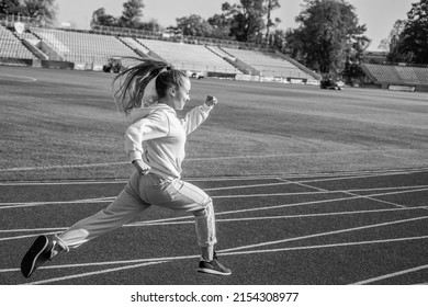 The Rule In Running Is Just Run. Energetic Girl Run On Running Track. Sports School