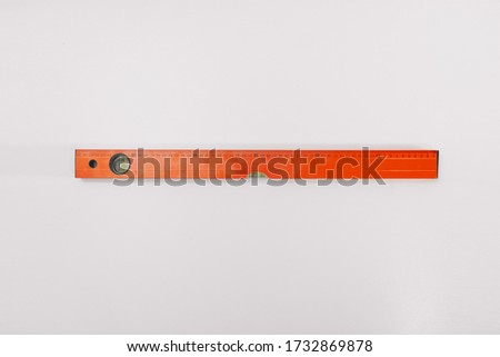 Ruler level on a white background isolation. Copy space on top. Construction Tools Sale Concept.