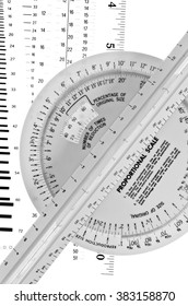 Rulers And Wheel Used In Drafting For Converting Units Of Measure By Proportion And Scale 